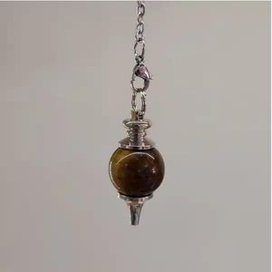 Metal pendulum with a stone ball
